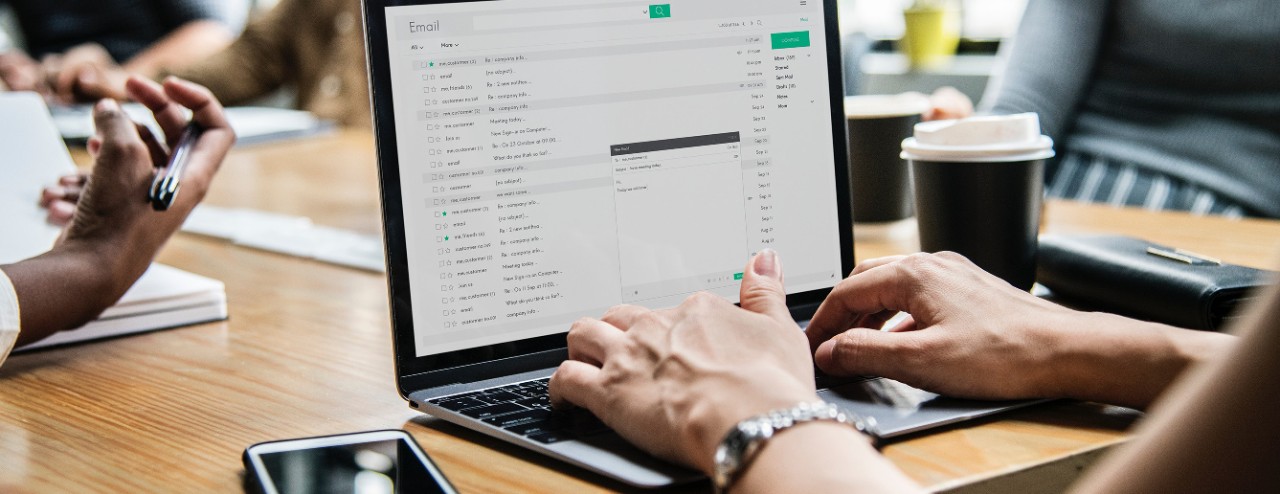 Image of person working on a laptop computer at a desk