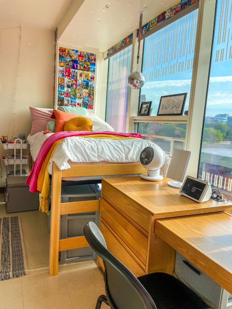 Morgens room with decorated bed against window with desk