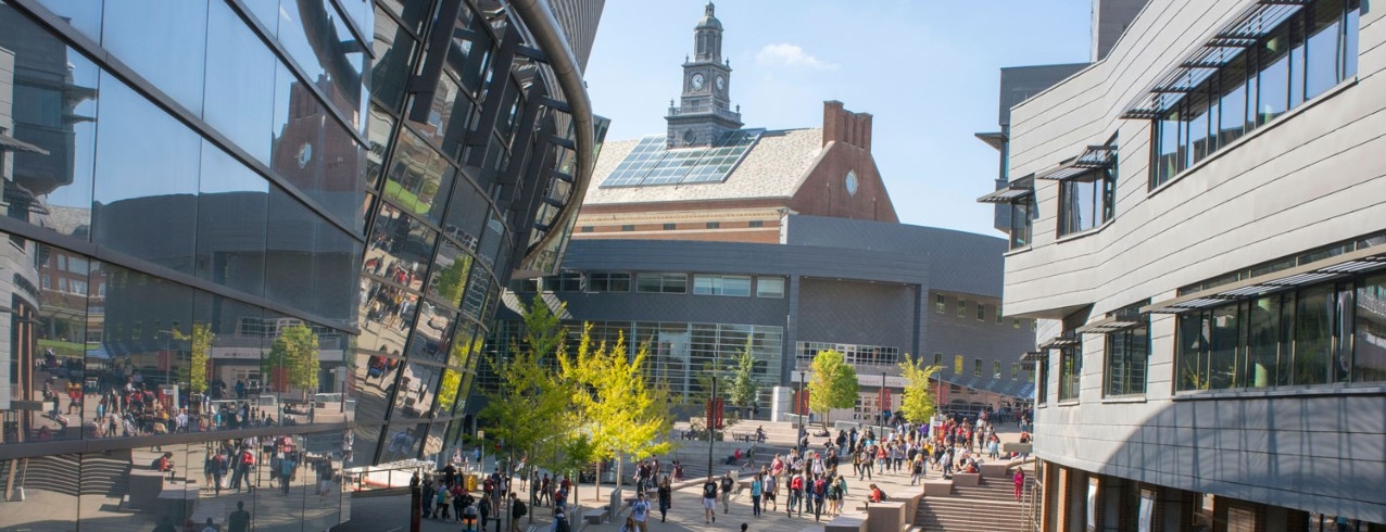 A view of Tangeman University Center with a crowd of people on Mainstreet.
